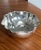 This beautiful Christian Dior hammered and silver-plated pleated bowl, circa Mid 20th Century is looking for a new home....