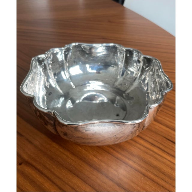 This beautiful Christian Dior hammered and silver-plated pleated bowl, circa Mid 20th Century is looking for a new home....
