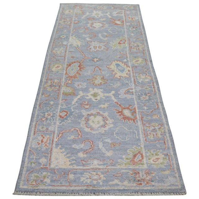 Hand-knotted with care using traditional rug making techniques, this wool rug blends timeless craftsmanship with a modern...