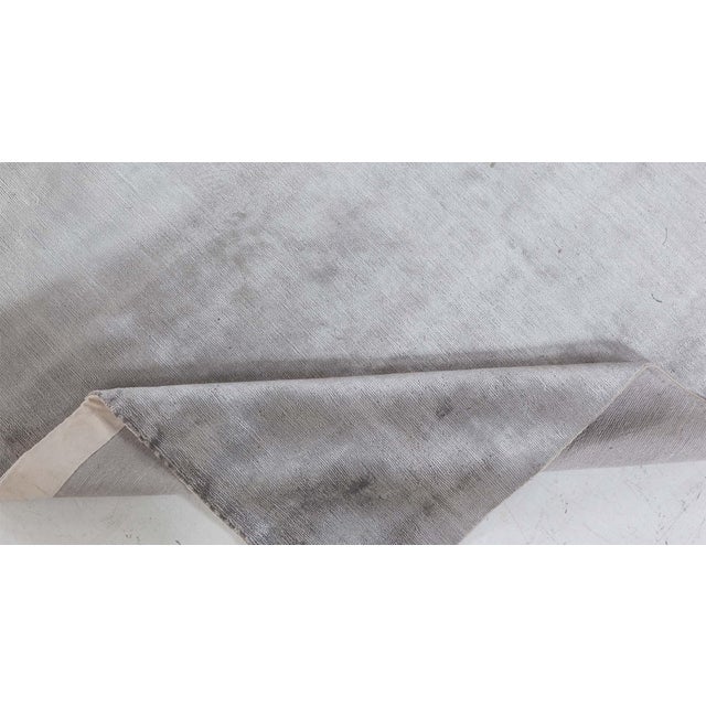 Contemporary Gray Silk Rug Size: 5'0" × 7'5" (152 × 226 cm) This contemporary monochromatic gray hand-knotted silk rug...