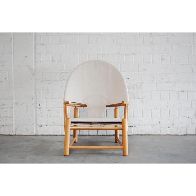 This Hoop lounge chair was designed by Piero Palange and Werther Toffoloni for Germa. The beech and canvas piece remains a...