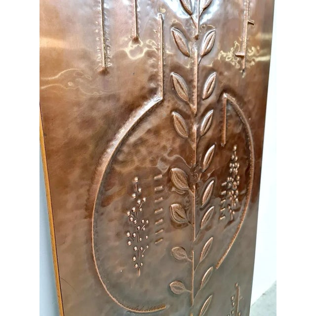 Beautiful handmade wall panel from the 70s with grain. Made from hand beaten copper. The artist has worked nicely with a...