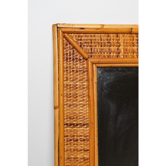 Bamboo and cane mirror, Made in Italy, 1970s. Bamboo and cane mirror made in Italy in the 1970s. It is in excellent...
