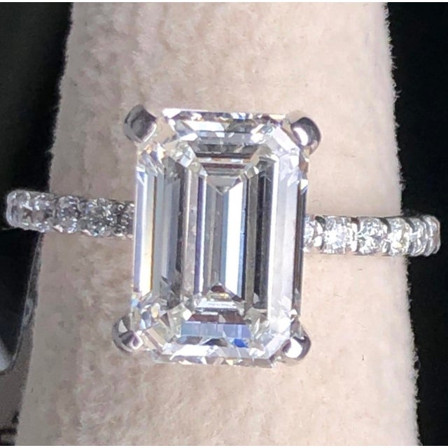 Stunning 3 carat VS clarity emerald cut brilliant lab grown diamond engagement ring in 14k white gold. A 3 carat emerald...