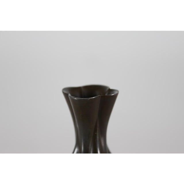 Small decorative Art Deco vase made of disco metal with brown patina. It's designed and made by the Danish artist Just...