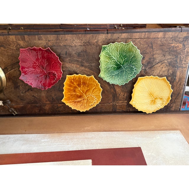 A beautifully sculpted set of four Williams Sonoma leaf plates, made in Italy and glazed in rich autumnal tones. Each...