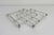 A timeless extendable silver-plated or zigzag trivet attributed to French modernist designer Jacques Adnet, made in the...