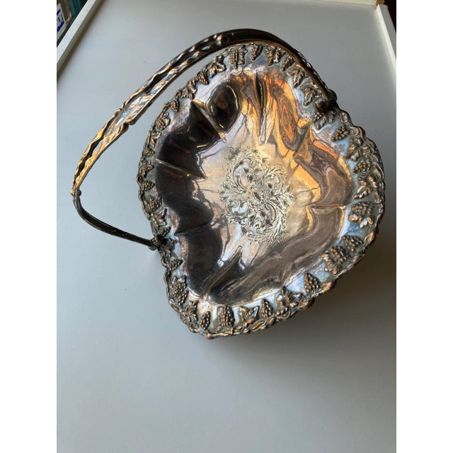 Victorian grape vine design edges, floral center , silver plated wedding basket 11.25"L X 9.25"W X 3"H , No makers mark,...