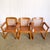 This set of four Mid Century Modern dining arm chairs showcases timeless craftsmanship with warm teak wood and clean,...