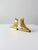 A pair of antique brass mantel ornaments shaped as Victorian ladies’ boots. Each features delicate scalloped detailing...