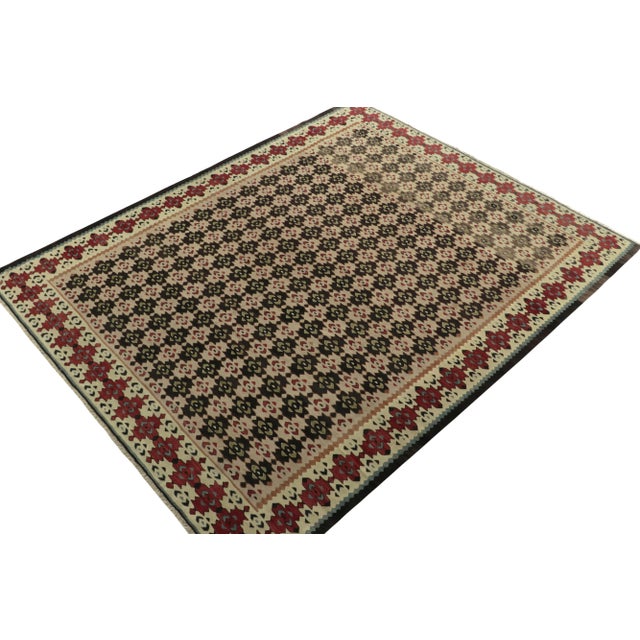Handwoven in fine wool, an 8x10 antique kilim rug from Turkey, now joining our coveted tribal collection. Carrying a folk...