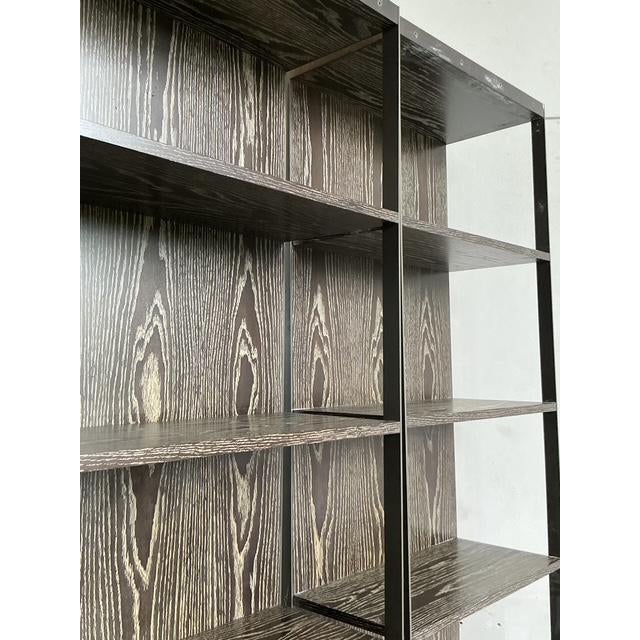 Presenting a sophisticated pair of vintage étagères, attributed to the iconic design of Christian Liaigre for Holly Hunt....