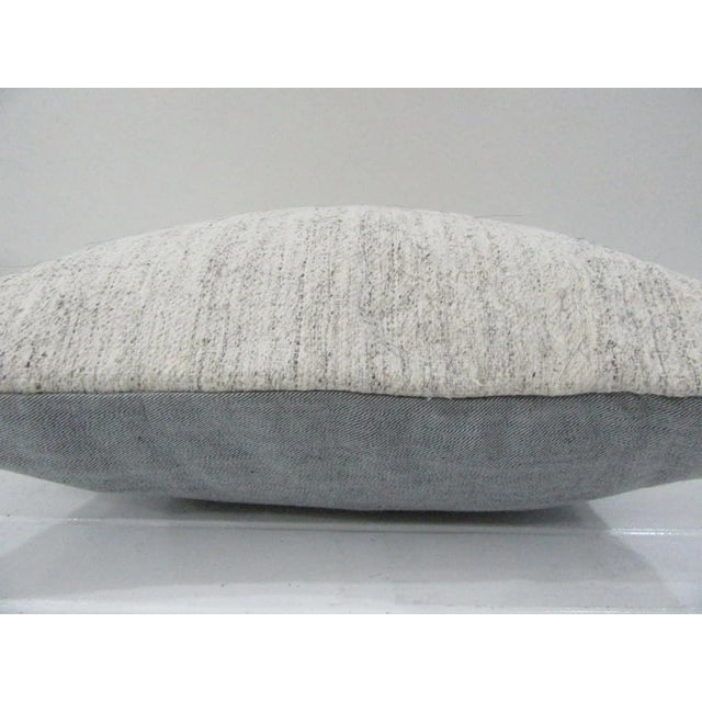 This is a pillow cover made from a vintage kilim rug. The piece was properly washed and ready to use. Pillow inserts not...