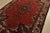 An authentic vintage traditional Baloch rug hand-knotted with fine wool and natural dyes. This rug features a central...