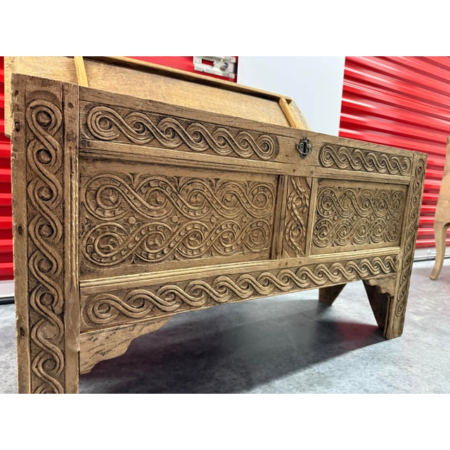 Charming carved antique trunk from Europe. Bleached finish