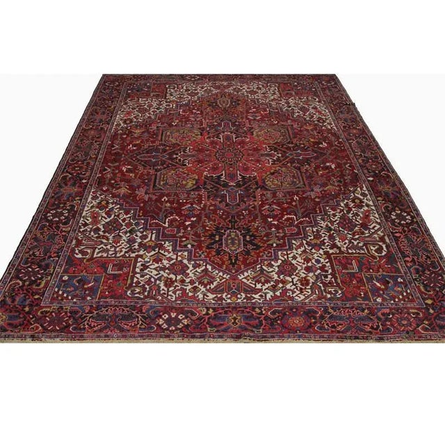 ACTUAL SIZE: 11’6″ x 14’9″ PRIMARY COLOR: Burgundy / Ivory / Navy AGE: Old MATERIALS: Wool FOUNDATION: Cotton PRODUCTION:...
