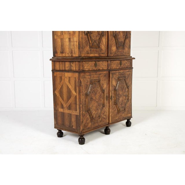 A 17th Century French Walnut Cabinet. This lovey cabinet is in the style of the Grenoble based furniture maker Thomas...