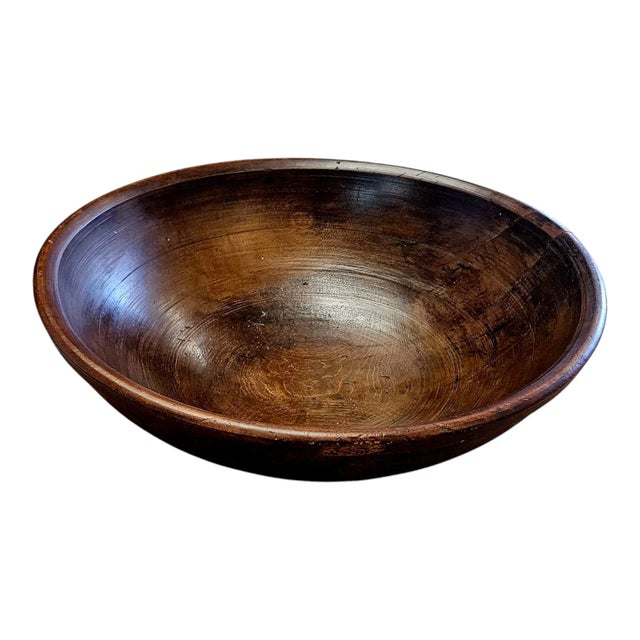 Turned with pronounced foot and rim. This bowl is 19th C. Has two cracks that do not effect the bowl’s stability. 22 "...