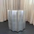 This sculptural, fluted Doric column drum table by The Sirmos Company, draws from classical architecture, executed with a...
