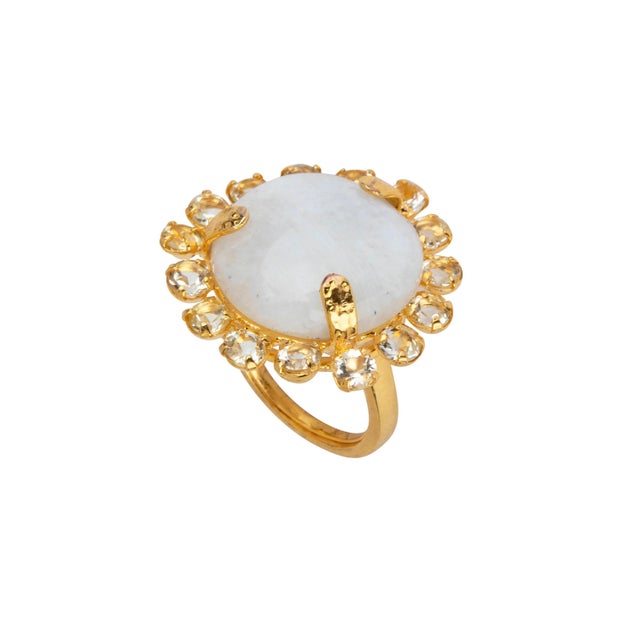 The Clementine Ring features a stunning circular semi-precious stone surrounded by an array of contrasting stones, exuding...