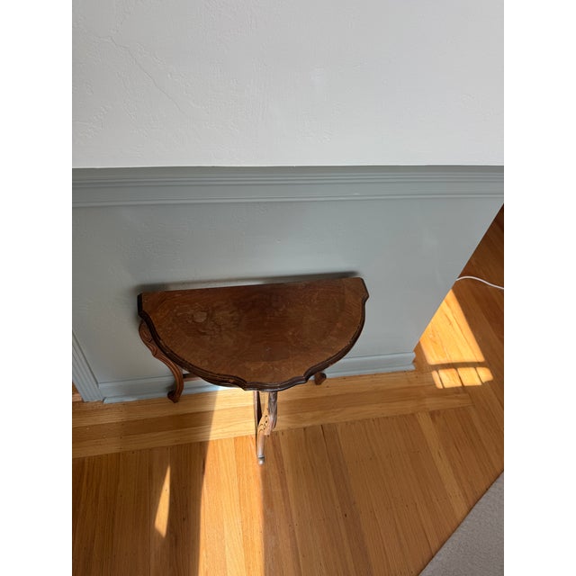 Elegant vintage demi-lune (half-moon) console table with graceful cabriole legs and carved apron detailing, inspired by...