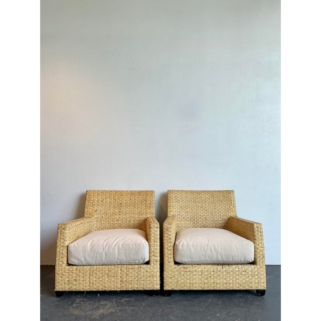 This exceptional pair of vintage lounge chairs, crafted in the sophisticated manner of McGuire Furniture, brings a refined...