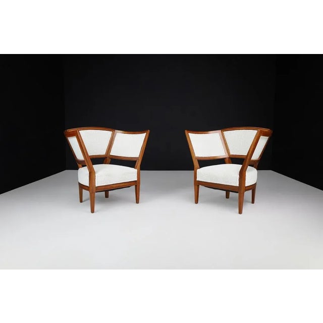 Pair of 19th Century French Armchairs in New Bouclé Upholstery This elegant pair of 19th-century French armchairs...