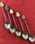 Sterling Silver! Adorable spoon set made in old Hong Kong. Features carved jade buddhas on the top of each spoon. Measure...