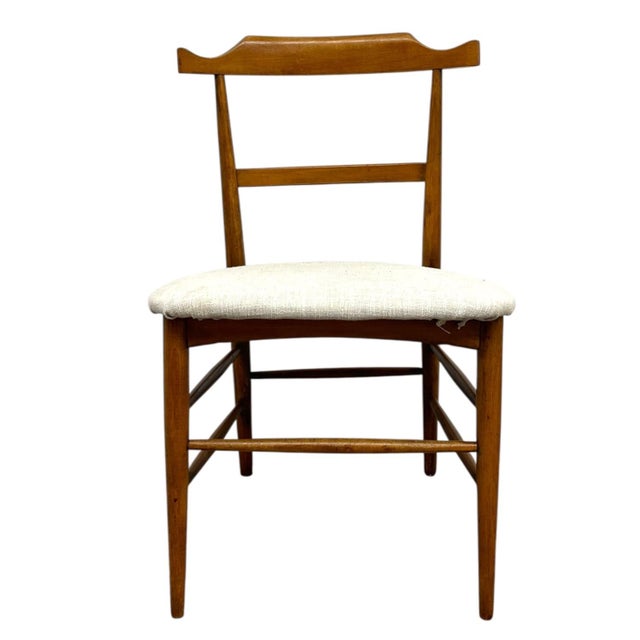 This vintage mid-century modern dining or side chair is designed in the style of Milo Baughman and features a clean,...