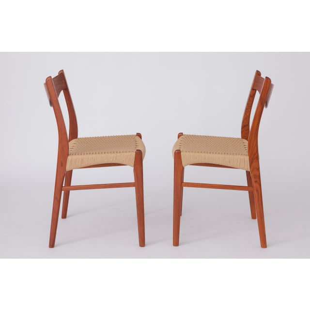 Add a touch of classic Scandinavian elegance to your dining space with this beautiful set of 4 vintage dining chairs...