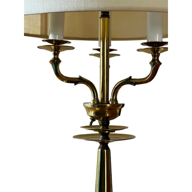 This modern and decorative combination of a three arm candelabra table lamp comes equipped with its original shade...