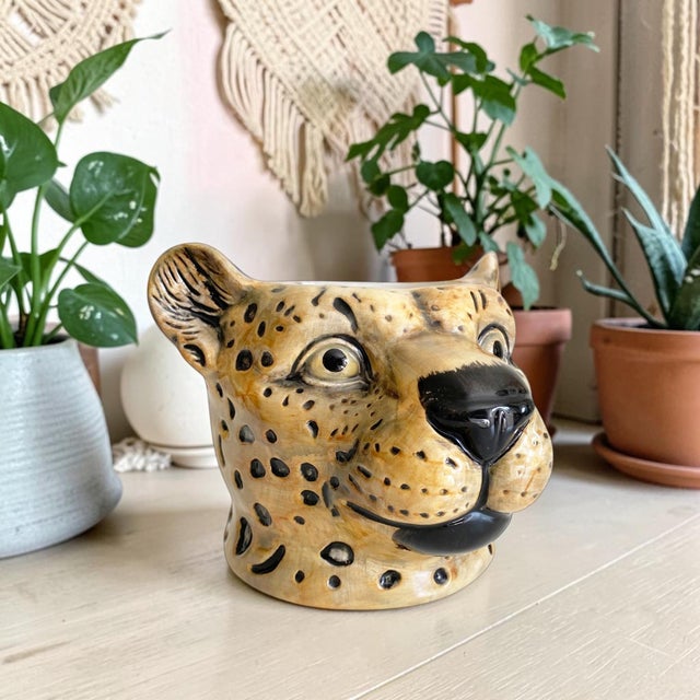 Elevate your home decor with the Ceramic Leopard Head Vase or Planter, a striking piece that combines artistry and...