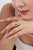 This Art Deco-style cluster ring features a striking 1.81 ct emerald and diamond, set in 14k yellow gold. The center...