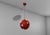Very rare Chandelier Model 553 by Oscar Torlasco for Lumi circa 1960s. Large red enameled metal sphere with brass diagonal...