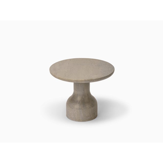 Designed by the Danish duo Depping & Jørgensen, this side table is a refined piece of art carved from solid limestone,...