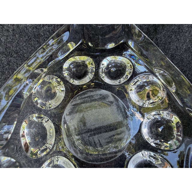 Heavy, oversized vintage mid century glass catchall, ashtray. Stylized triangular shape with hollowed out circles along...