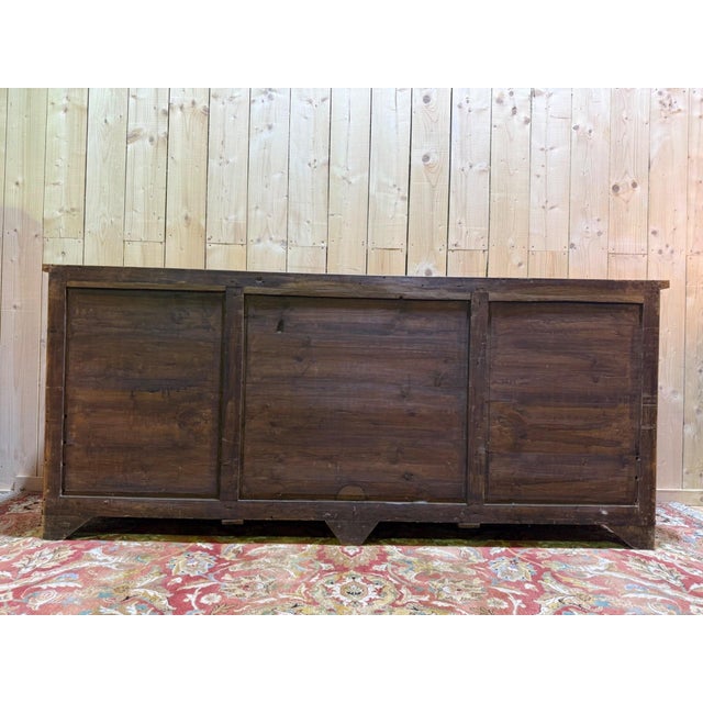 A 19th-century English sideboard, crafted from solid mahogany and of excellent construction. The piece features a...