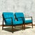 Exceptional pair of Mid-Century Modern lounge chairs crafted in the style of iconic Dux designs. Featuring sleek,...