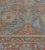 This antique, circa 1920, Mahal rug has a light blue field with an overall brick-red and buff-brown herati-pattern, in a...