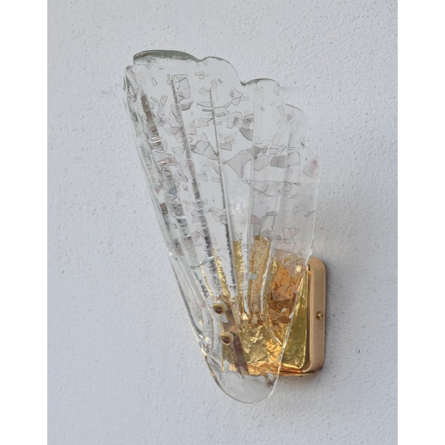 Elegant set of 5 original Italian wall lamps made of Murano glass in the 1970s, featuring a refined glass diffuser with...