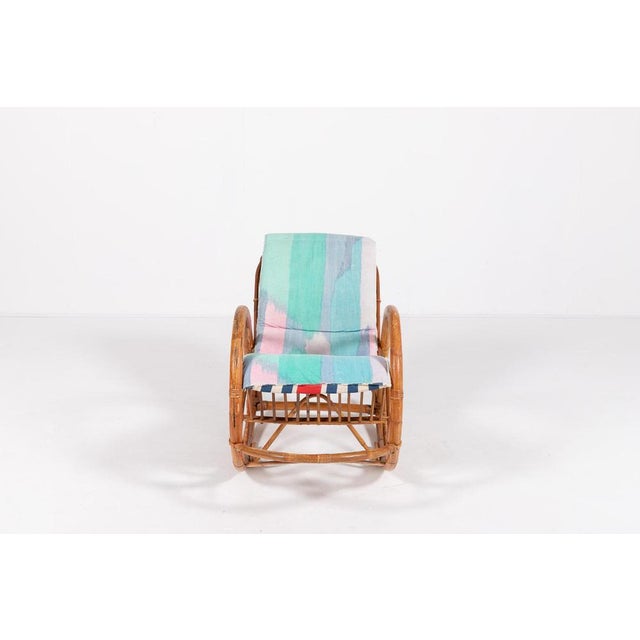 Sculptural vintage rocking chair from 1960’s. The chair features sculptural bamboo frame with a seat and backrest in...