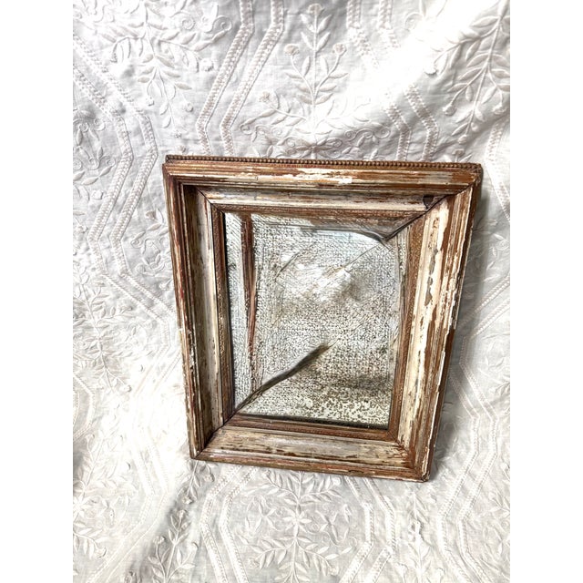 Imperfectly perfect! This charming vintage mirror features a beautifully timeworn painted wood frame with warm ivory, soft...
