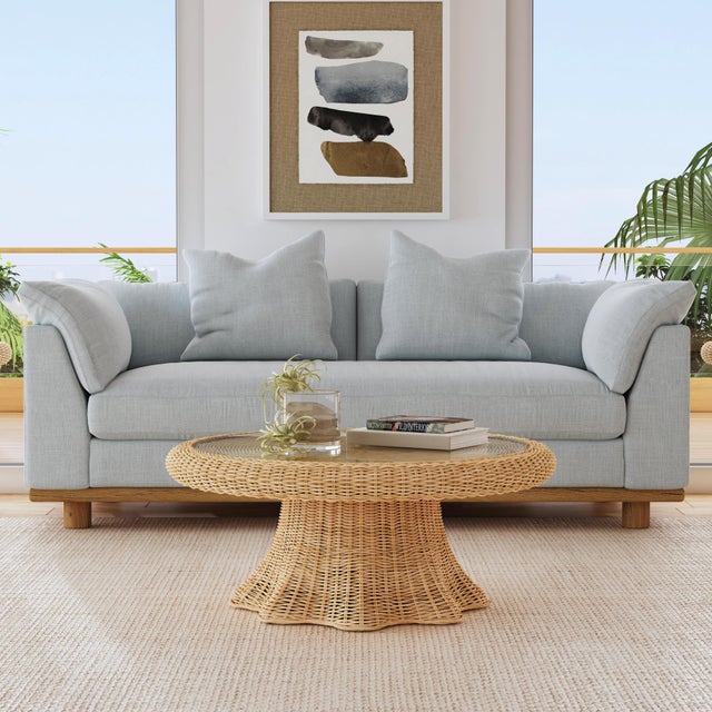 Elevate your space with our Butler Specialty Company Flora natural rattan coffee Table. Crafted with love, its glass inset...
