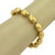 This authentic Gurhan Cocoon bracelet is crafted in rich 24k yellow gold and features a strand of hand-hammered beads that...