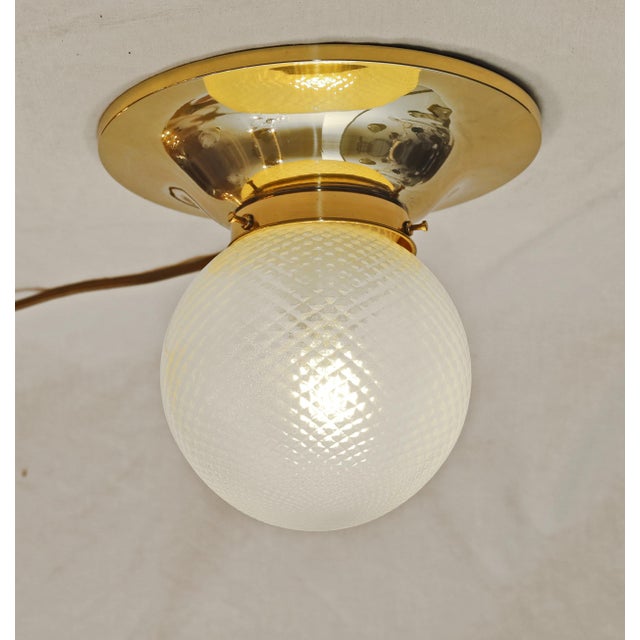 Art Nouveau ceiling lamp, circa 1915. Brass. Original glass shade. The lamp has been completely restored. Brass polished...