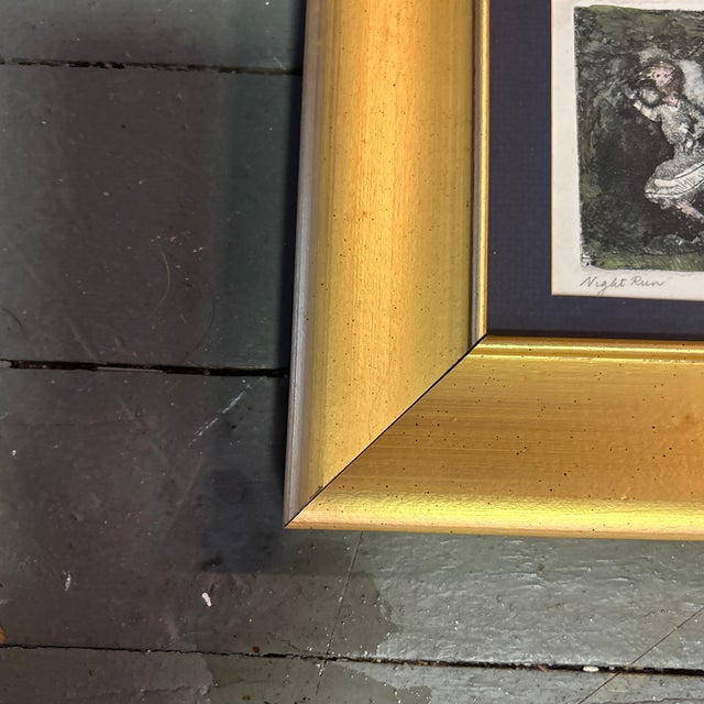 1990’s original dog chasing girl etching. Signed, dated and framed. Artist is Marcia Wilson. Image measures approximately...