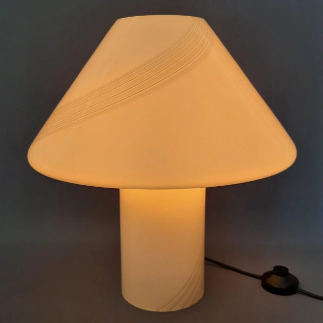 This imposing and iconic mushroom (or cone) table lamp is a piece of italian modernism of the highest quality, attributed...