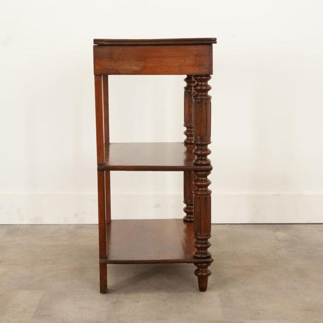 Dimensions: 34-⅞”H x 27-⅜”W x 16-½”D A solid walnut etagere-table from England, circa 1870, also known as a "whatnot" to...