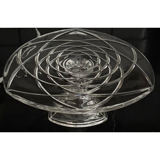 This exceptional mid-century Polish studio art glass centerpiece embodies sculptural presence and refined craftsmanship....