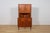 This tall corner cabinet was produced in Denmark in the 1960s and is an excellent example of Scandinavian Mid-Century...